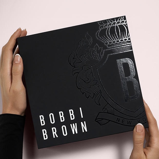 Bobbi Brown crest icon embossed in gold, matalic foil